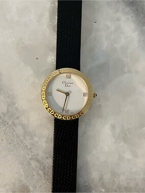 Dior Women's Black and Gold CD Logo Round Watch